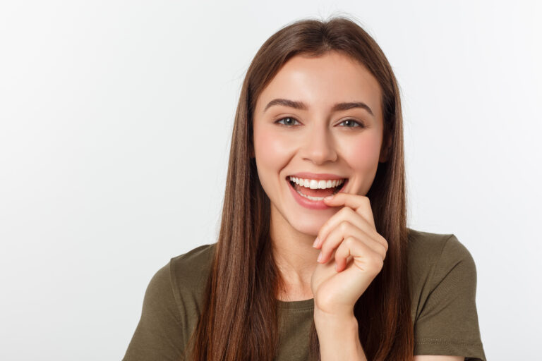 Smiling young woman showing healthy white teeth and a confident smile